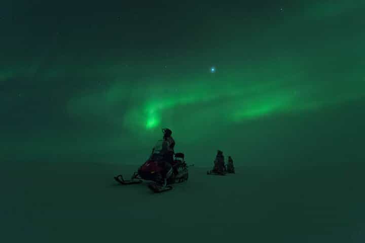 Authentic Northern Lights Snowmobile Safari in Levi with Campfire Snacks & Hot Drinks
