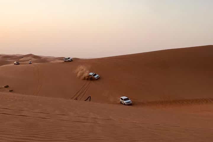 Abu Dhabi Desert safari with BBQ Dinner,Sandboarding & Camel ride