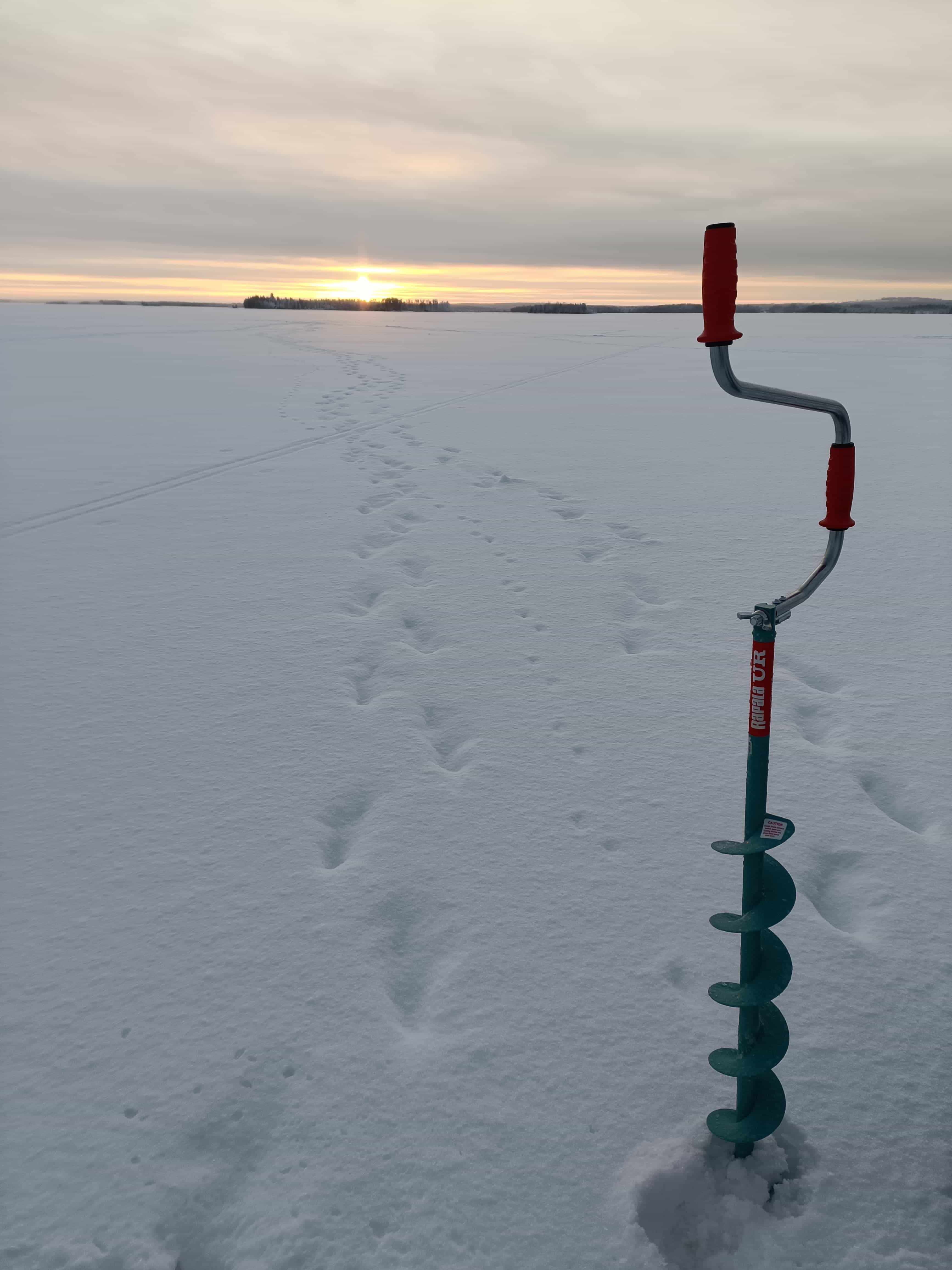 ICE FISHING EXPERIENCE ON A FROZEN LAKE