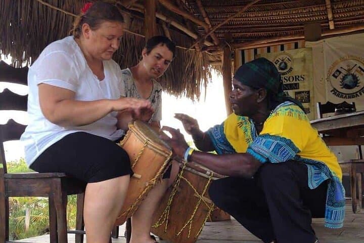 Sunset under the Ceiba with Live Drumming Overwater.