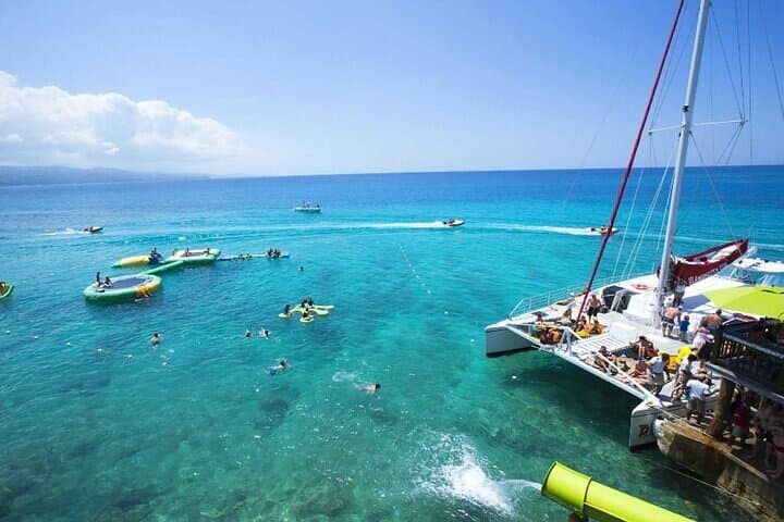 Bamboo Rafting & Catamaran Party Boat with Open Bar & Snorkeling
