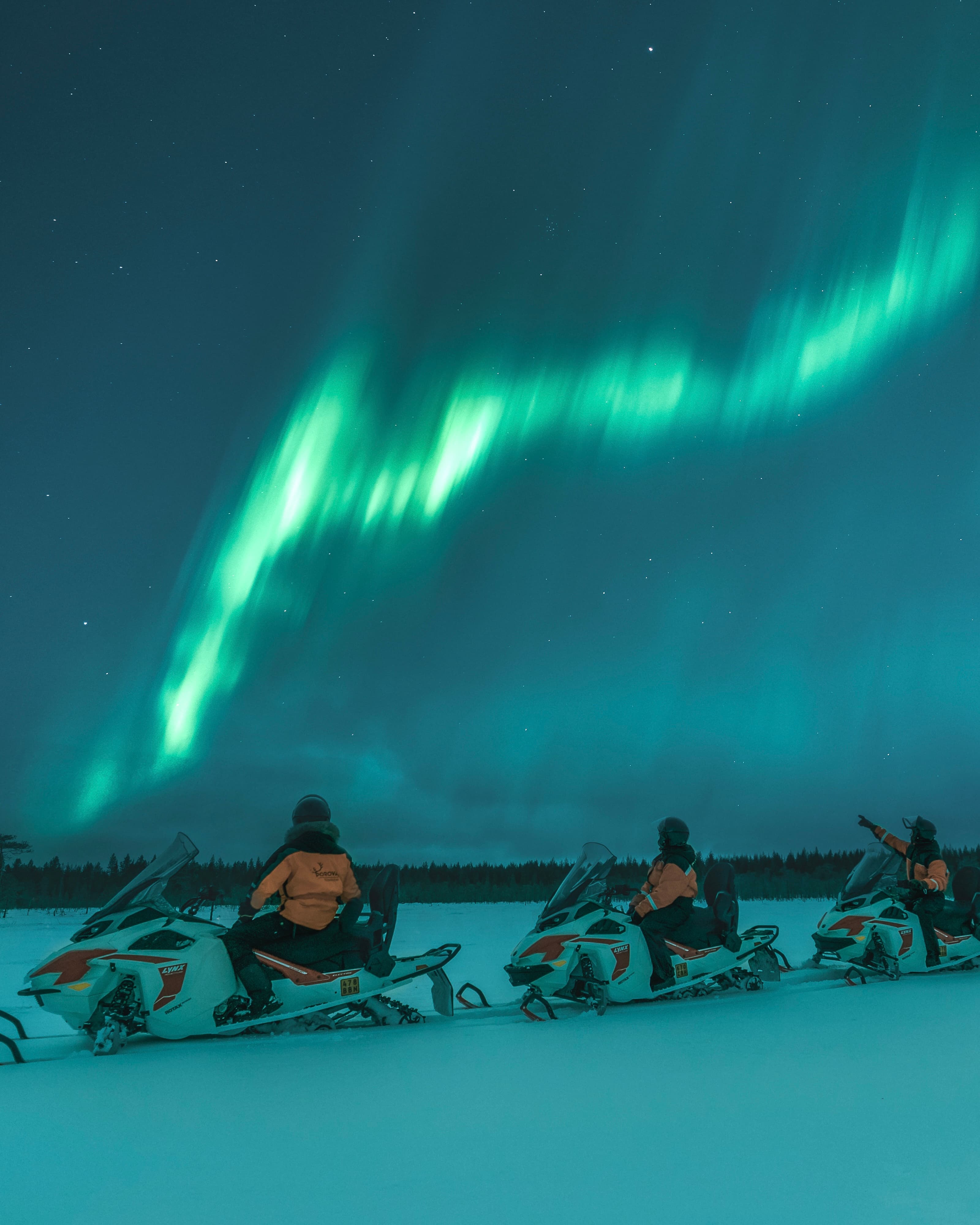 Northern Lights safari and meeting reindeer on electric snowmobiles in Rovaniemi