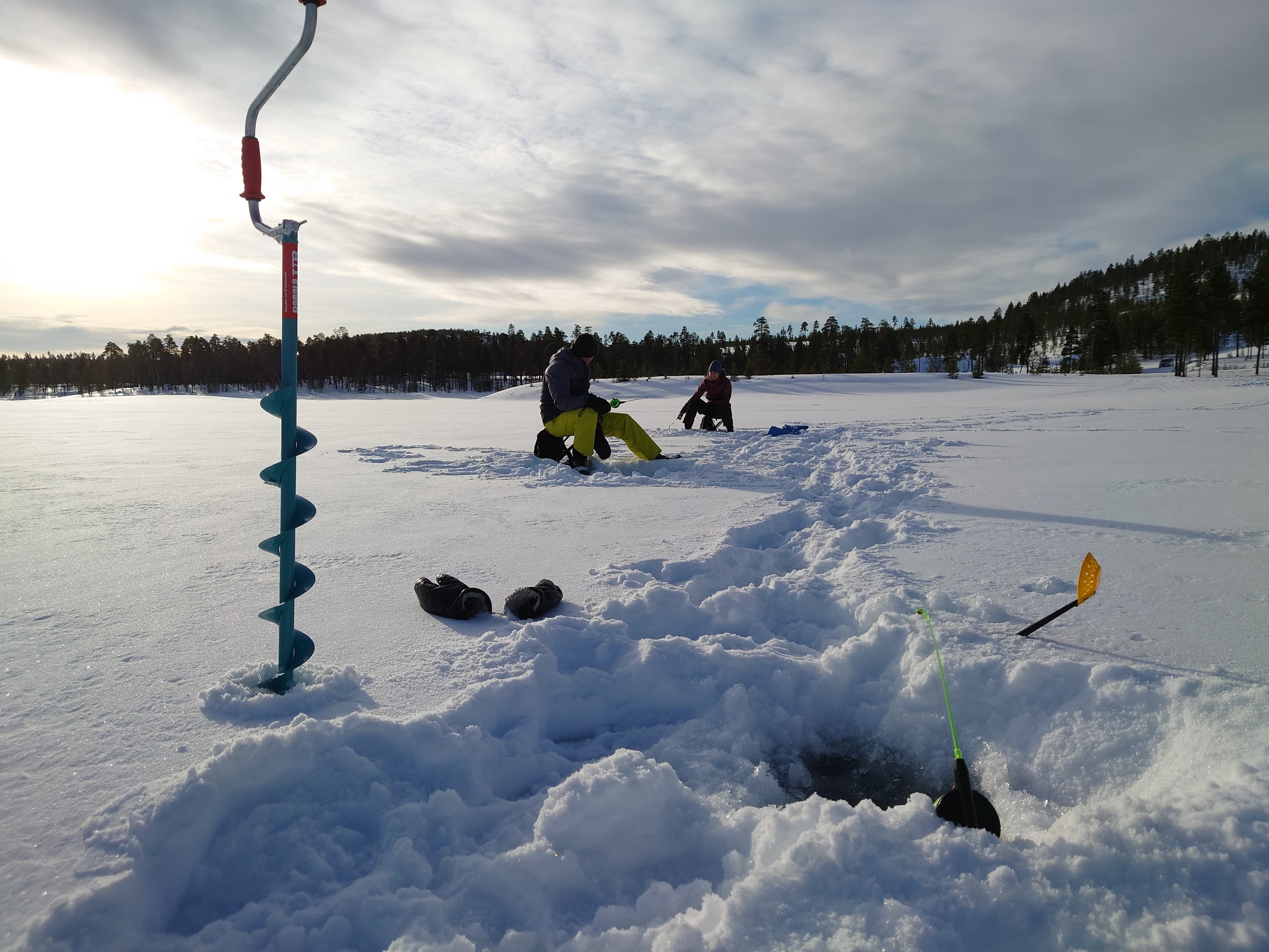 Ice-fishing safari by ELECTRIC CAR  to the wilderness lake
