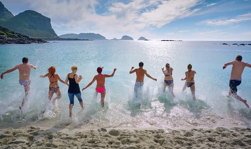 Group of people enjoying a trip together in beach