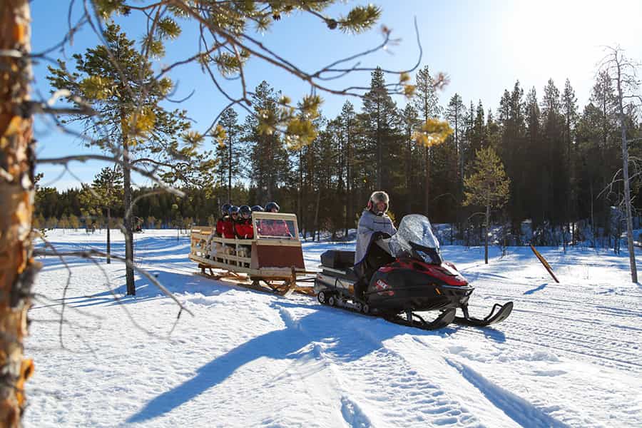 Reindeer Herder’s Day in the Wilderness with a Snowmobile sled, Levi
