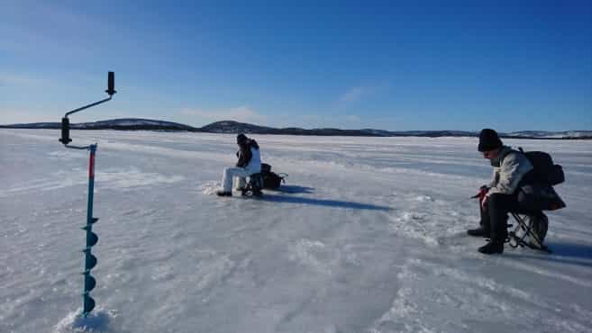 Ice-fishing safari by ELECTRIC CAR to the wilderness lake